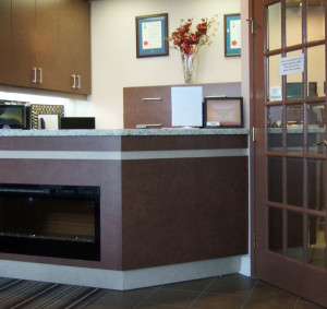 Dental office reception area including fireplace